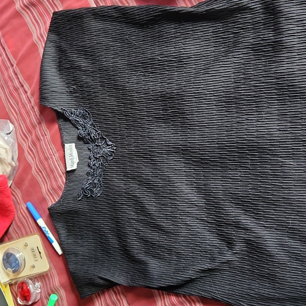 Black cap sleeve, ribbed shirt.